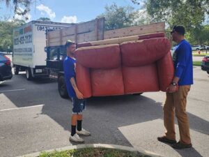 Speedy Hauling team removing furniture in Tampa Florida