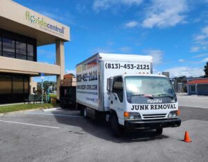 Speedy Hauling junk removal truck parked in Tampa Florida during a residential junk removal job