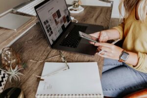 “Person decluttering digital files and organizing desktop on a laptop”