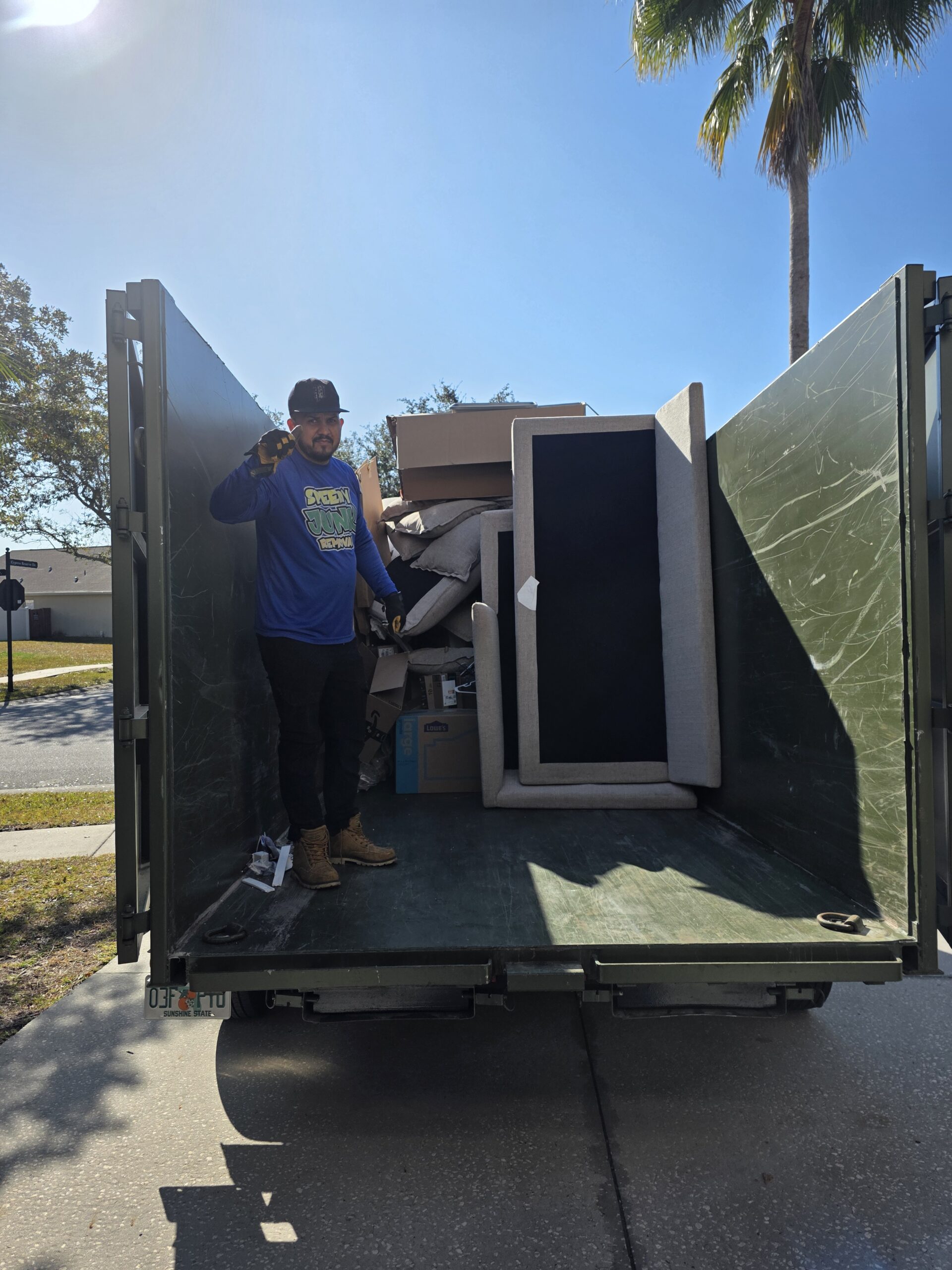 Tampa bulk pickup guide showing junk removal truck and furniture at curb in Tampa Florida